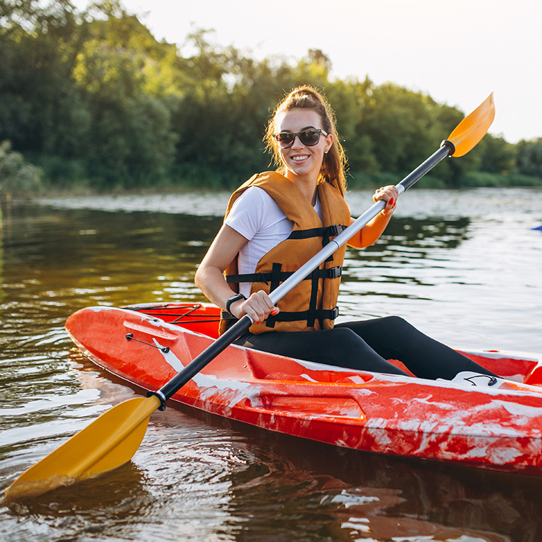 couple-together-kayaking-river